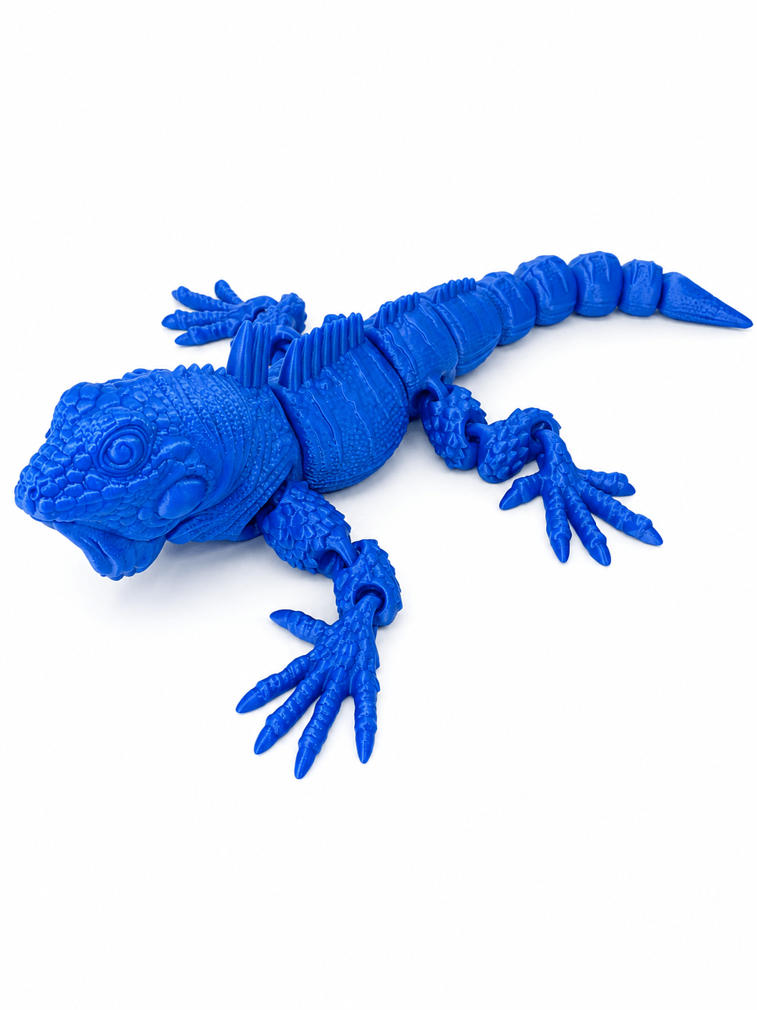 Blue articulated flexi iguana toy with detailed scales and movable limbs. Blue articulated flexi iguana toy with detailed scales and movable limbs.