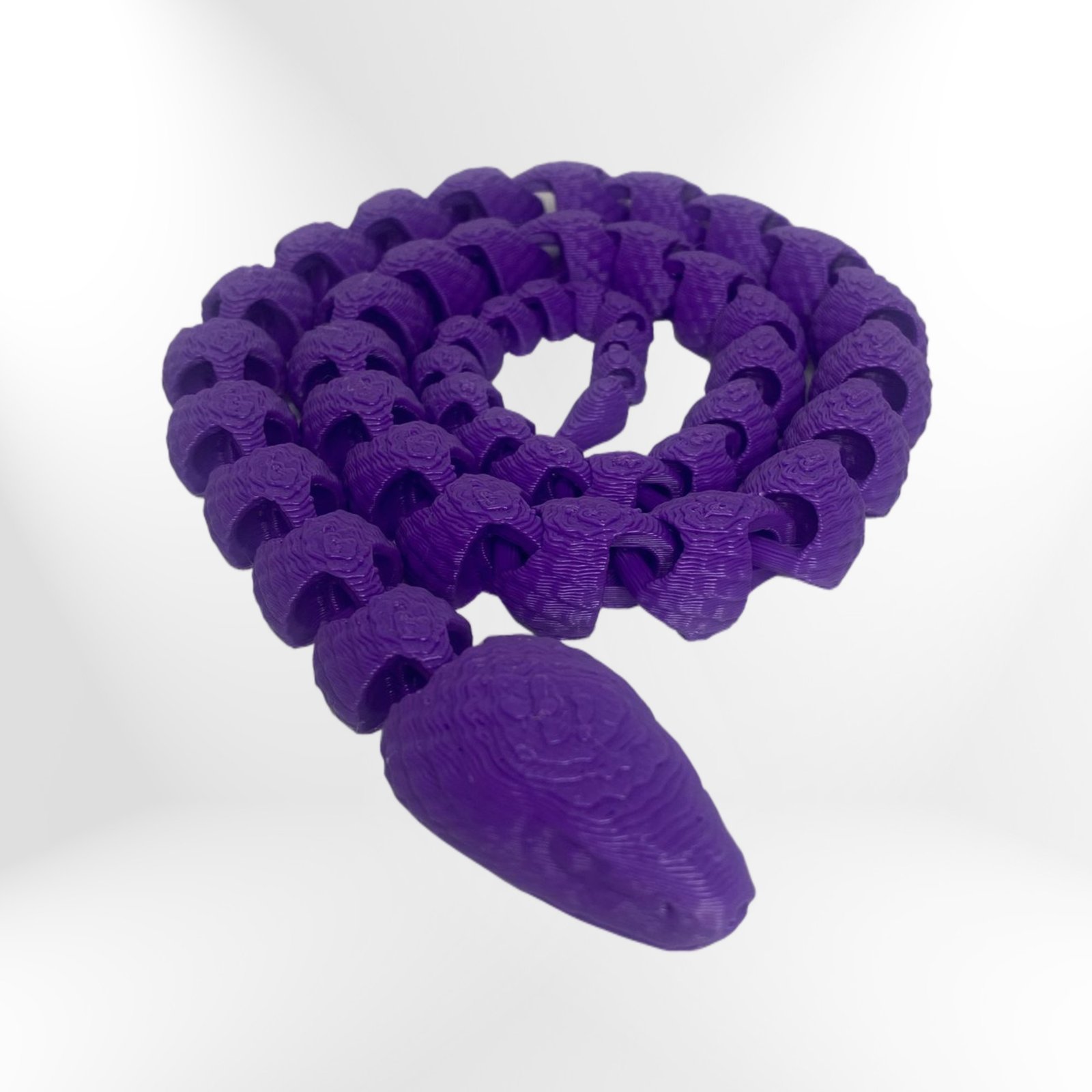 Scaled Fidget Snake: Purple interactive stress relief toy with segmented design Scaled Fidget Snake: Purple interactive stress relief toy with segmented design