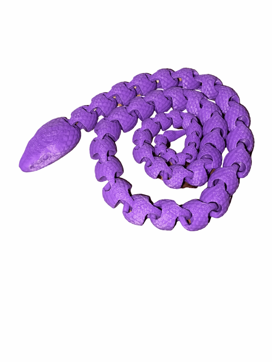 Purple Fidget Snake White Bg Purple Scaled Fidget Snake toy in a coiled position