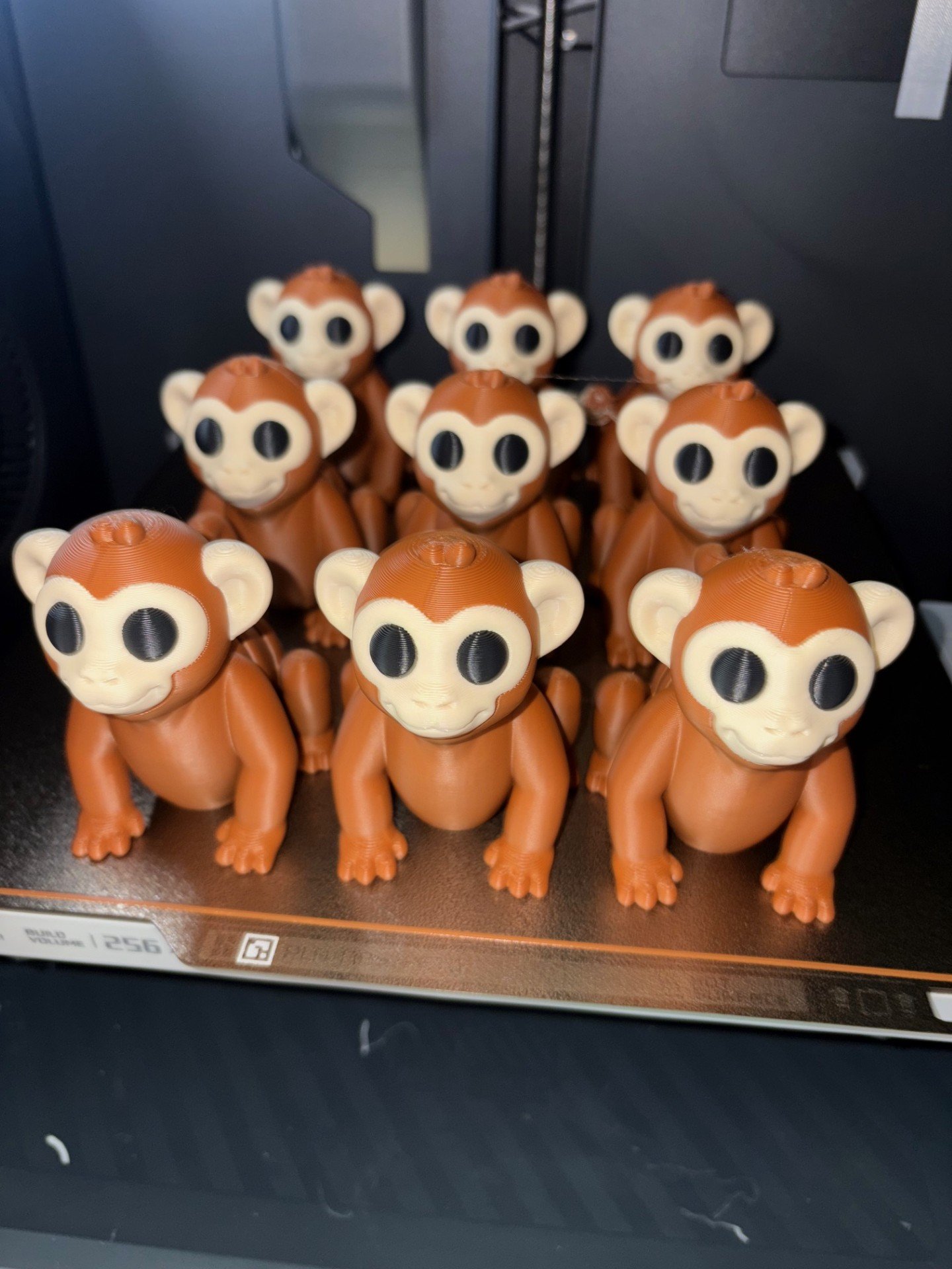 3D print monkey figurine. Brown and white toy animal printed in a 3D printer. Perfect as a gift or display piece. 3D print monkey figurine. Brown and white toy animal printed in a 3D printer. Perfect as a gift or display piece.