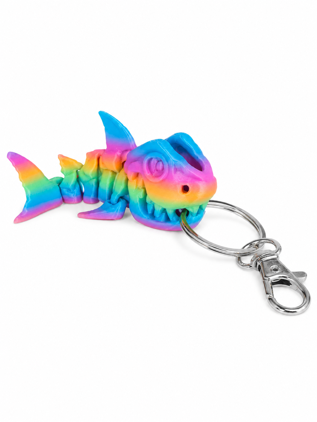 ChatGPT Image Jul 17 2026 11_04_08 AM Rainbow colored articulated shark keyring with metal clasp.