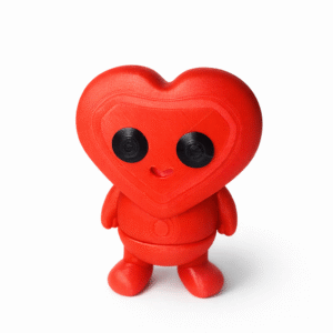 Axolotl (Copy): Red 3D printed heart-shaped robot figurine with black eyes and a small smile.