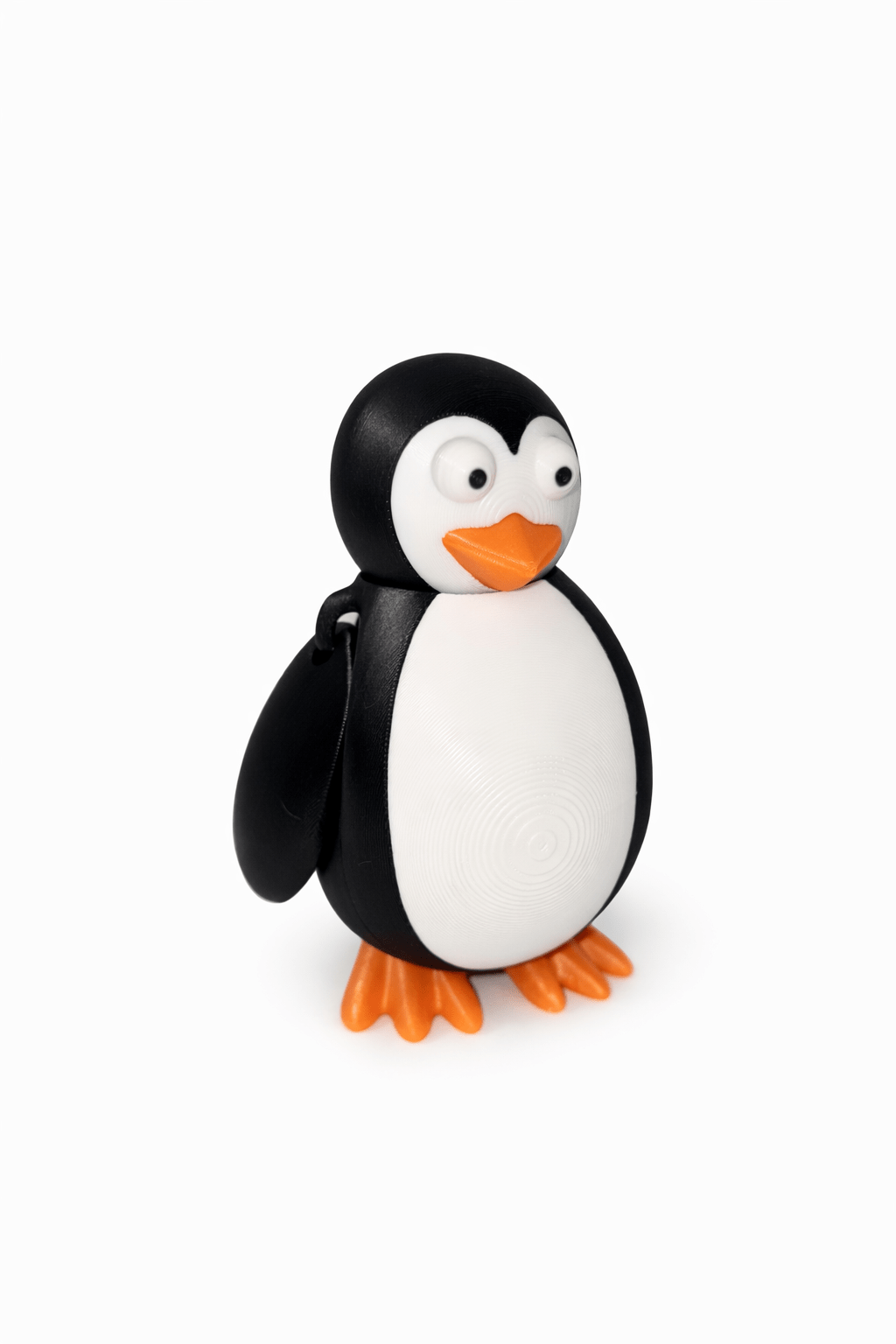 ChatGPT Image Apr 1 2026 10_34_27 AM Cute 3D printed penguin figurine with black and white body, orange beak and feet.