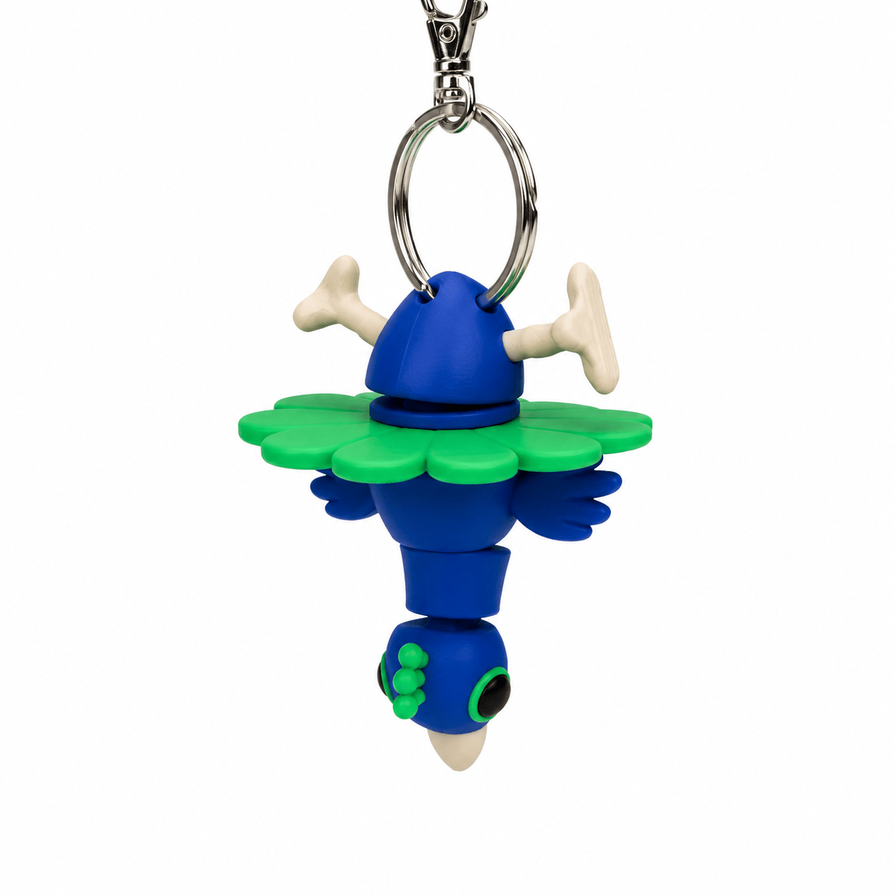 Blue and green peacock keyring with a flower-shaped skirt and bone-like accents. Blue and green peacock keyring with a flower-shaped skirt and bone-like accents.