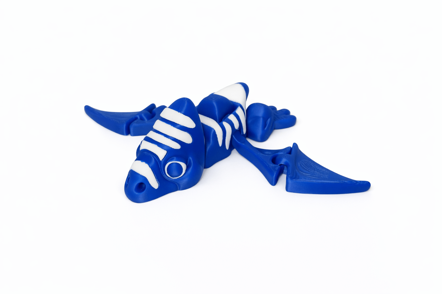 ChatGPT Image Mar 13 2026 02_11_28 PM AUTO-DRAFT: Blue and white dragon toy figure.