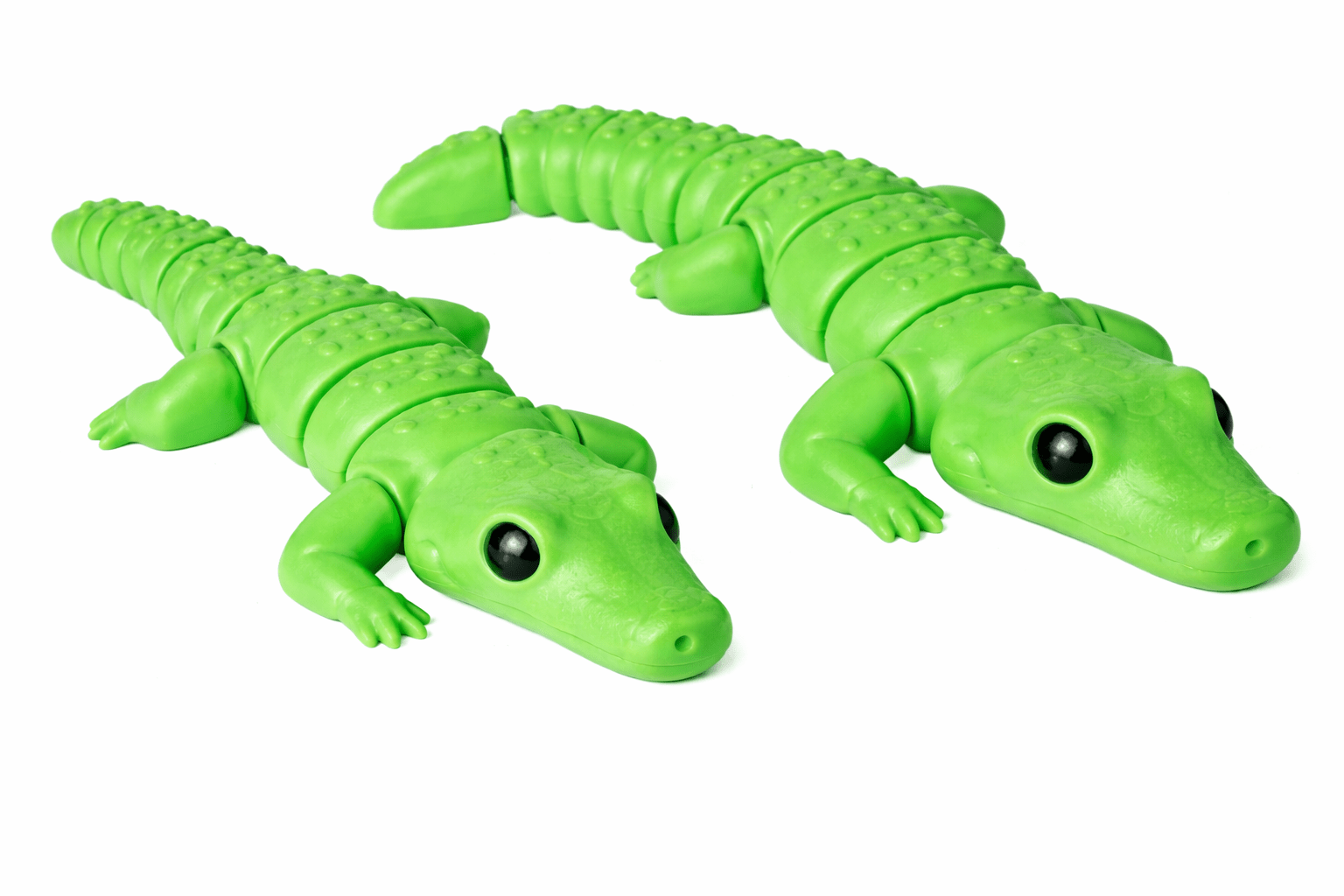 ChatGPT Image Mar 3 2026 02_36_07 PM AUTO-DRAFT: Two green plastic toy alligators, detailed with segmented bodies and realistic features.