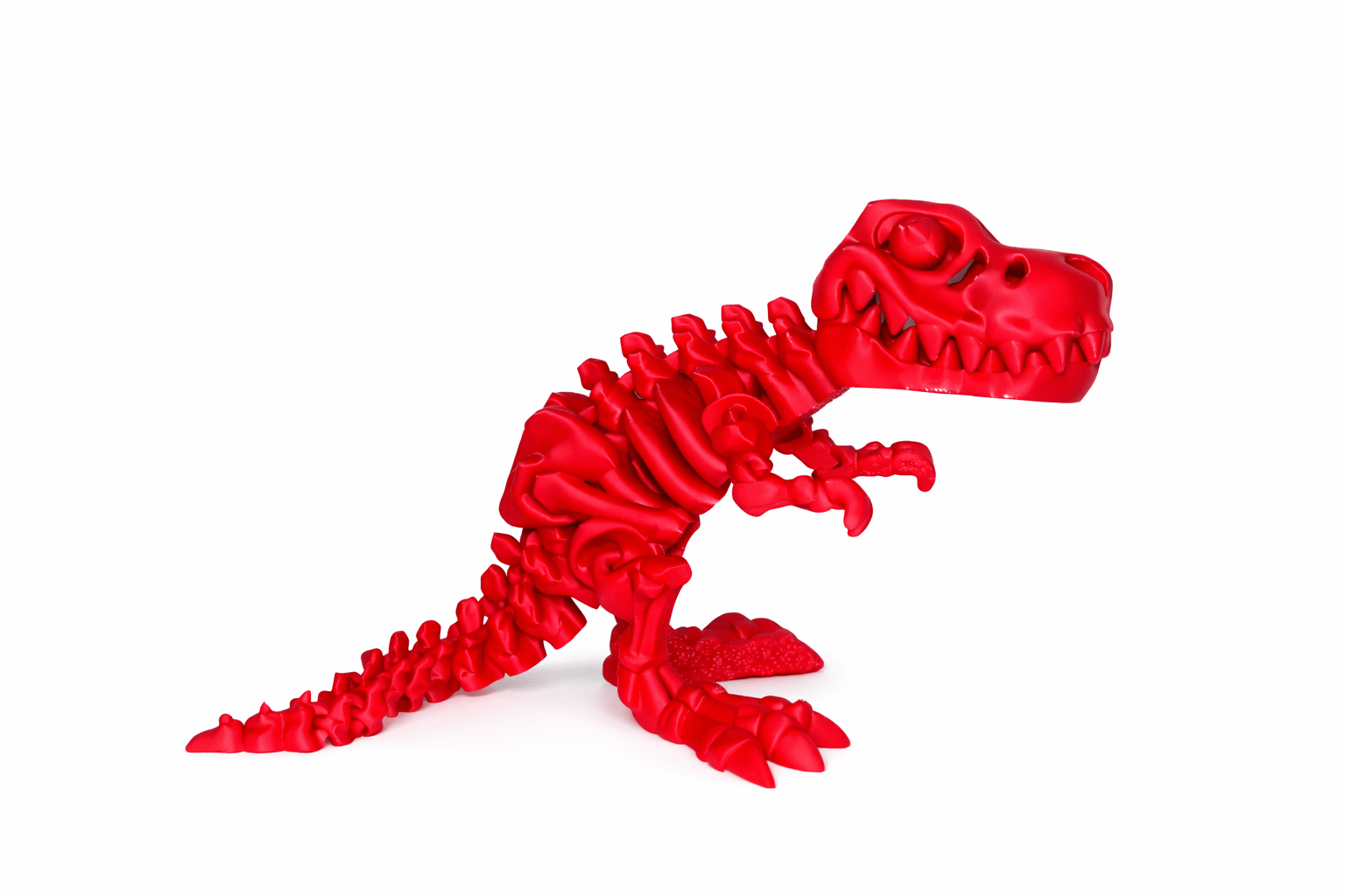 ChatGPT Image Mar 9 2026 01_20_26 PM Red dinosaur toy with skeletal design.