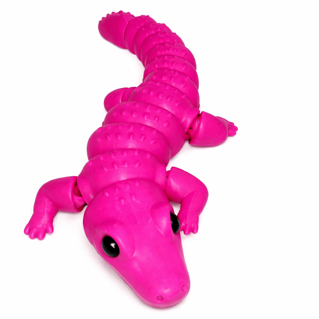 ChatGPT Image Mar 9 2026 12_12_42 PM AUTO-DRAFT: Pink plastic toy alligator with flexible, segmented body