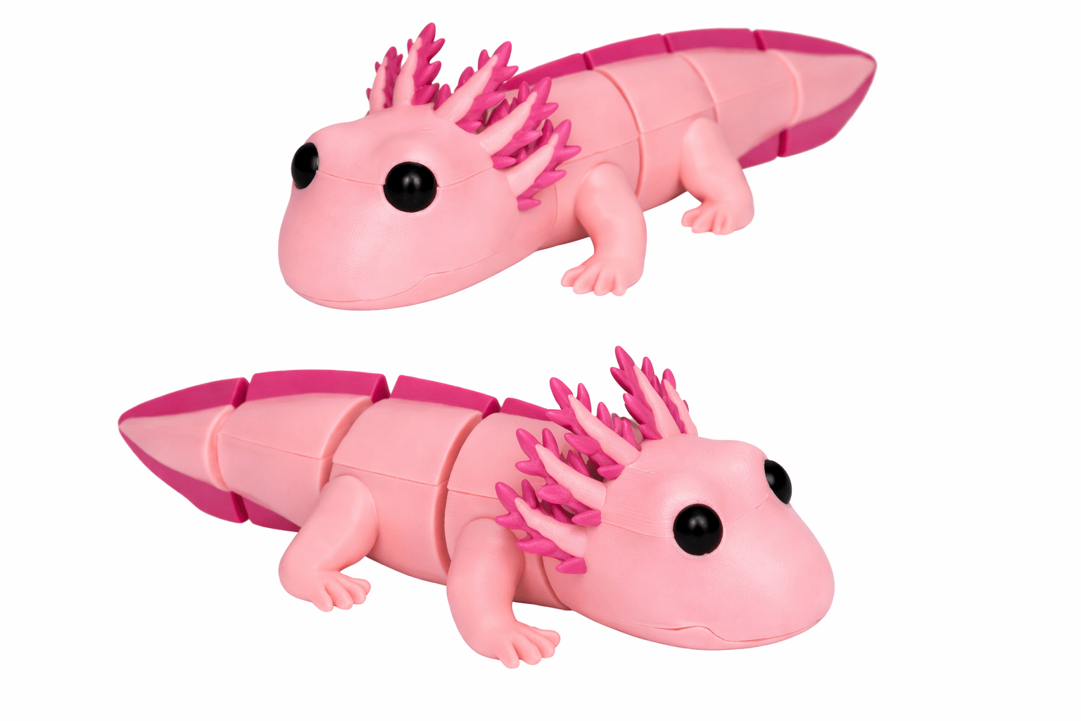 Pink Axolotl Toy Close Up Shots Adult Axolotl: Two pink segmented axolotl toys with frilly gills and cute faces.