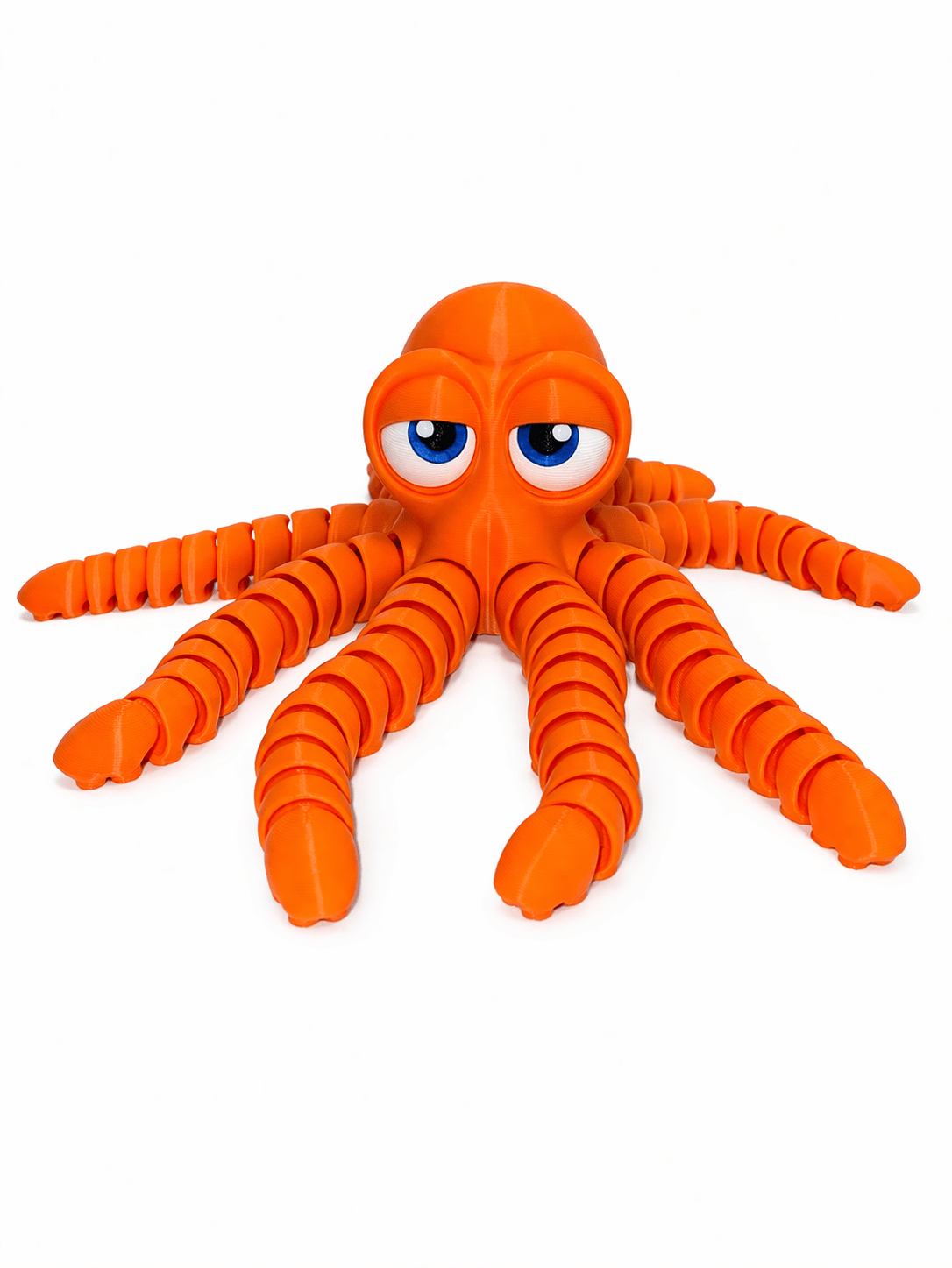 Orange Octo Whit Ebg 2 Orange Octopus toy with segmented tentacles and large, expressive blue eyes.
