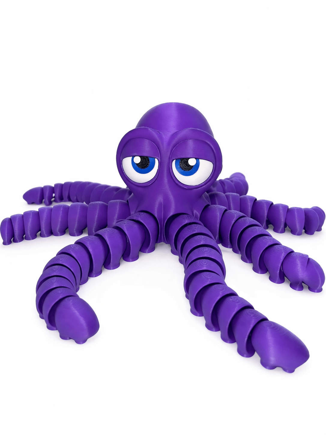 Purple Octopus White Bg 2 Purple Octopus toy with articulated tentacles and big eyes