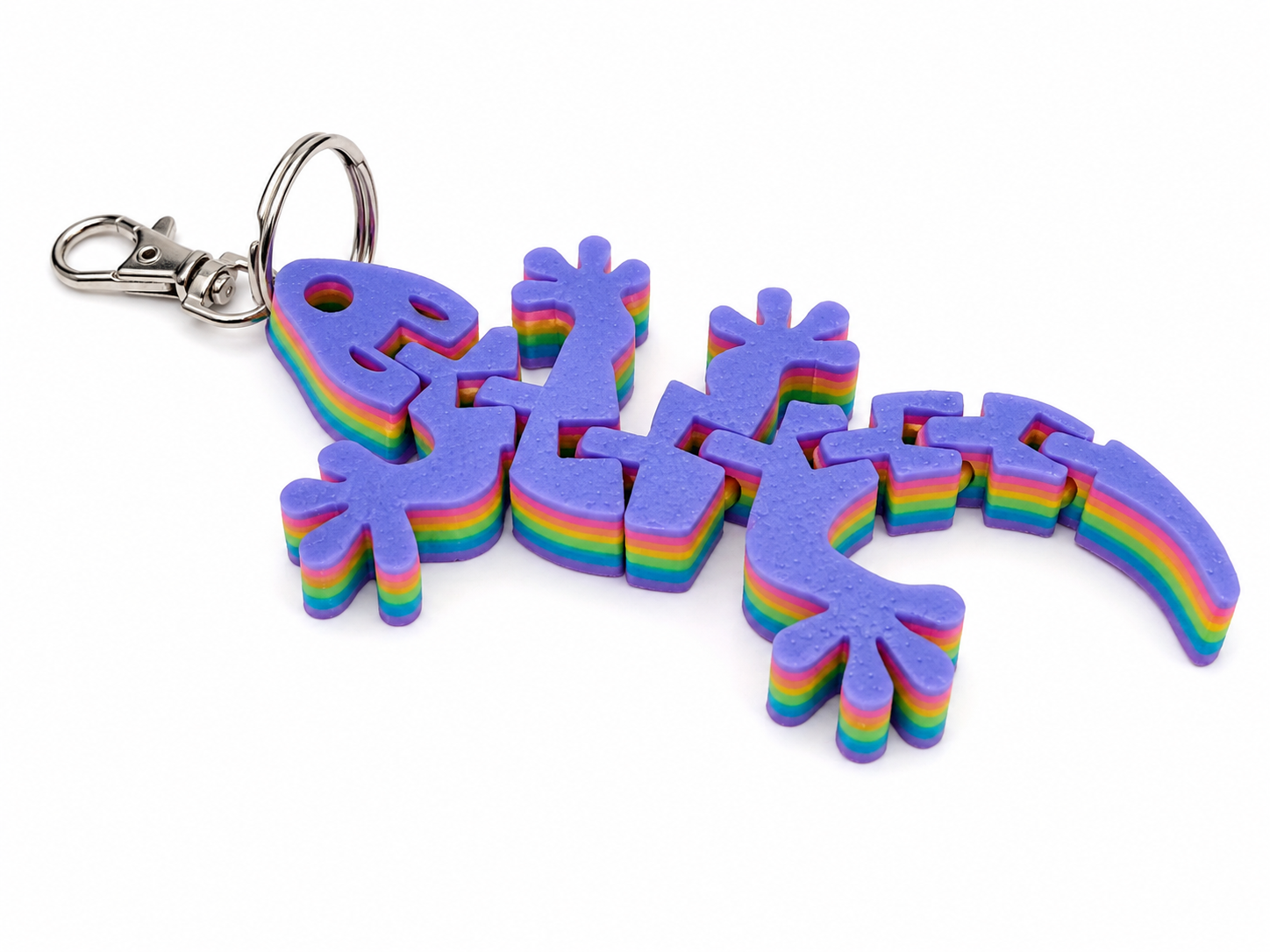 Colorful layered foam gecko keyring with a silver clasp and keyring attachment. Colorful layered foam gecko keyring with a silver clasp and keyring attachment.