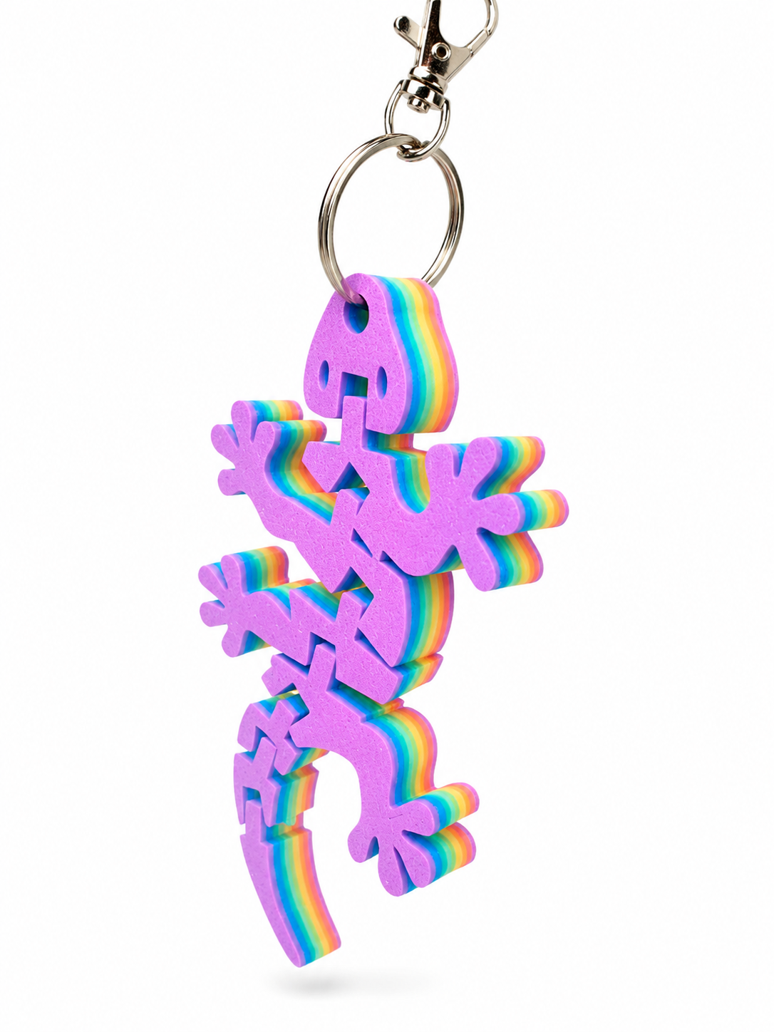 Rainbow-colored foam gecko keyring attached to a silver keychain clip. Rainbow-colored foam gecko keyring attached to a silver keychain clip.